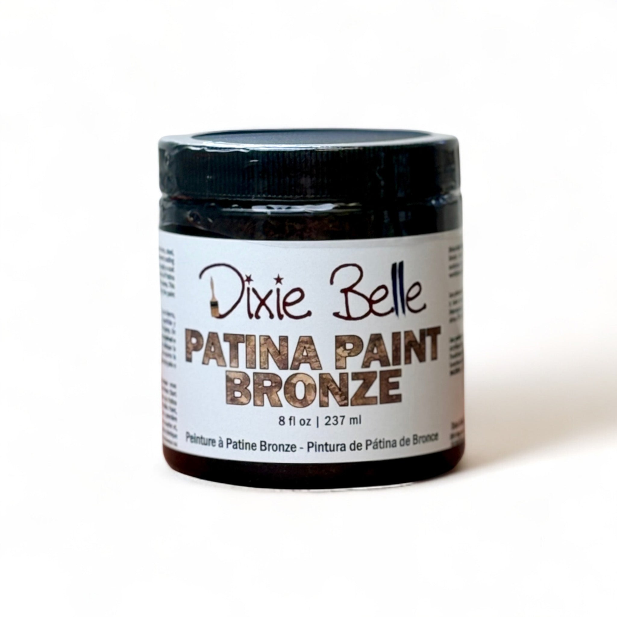 An 8oz container of Dixie Belle Paint's Patina Paint Bronze is against a white background.