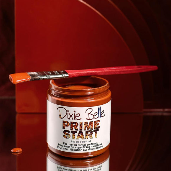 Jar of Dixie Belle Prime Start with a paintbrush on a red background