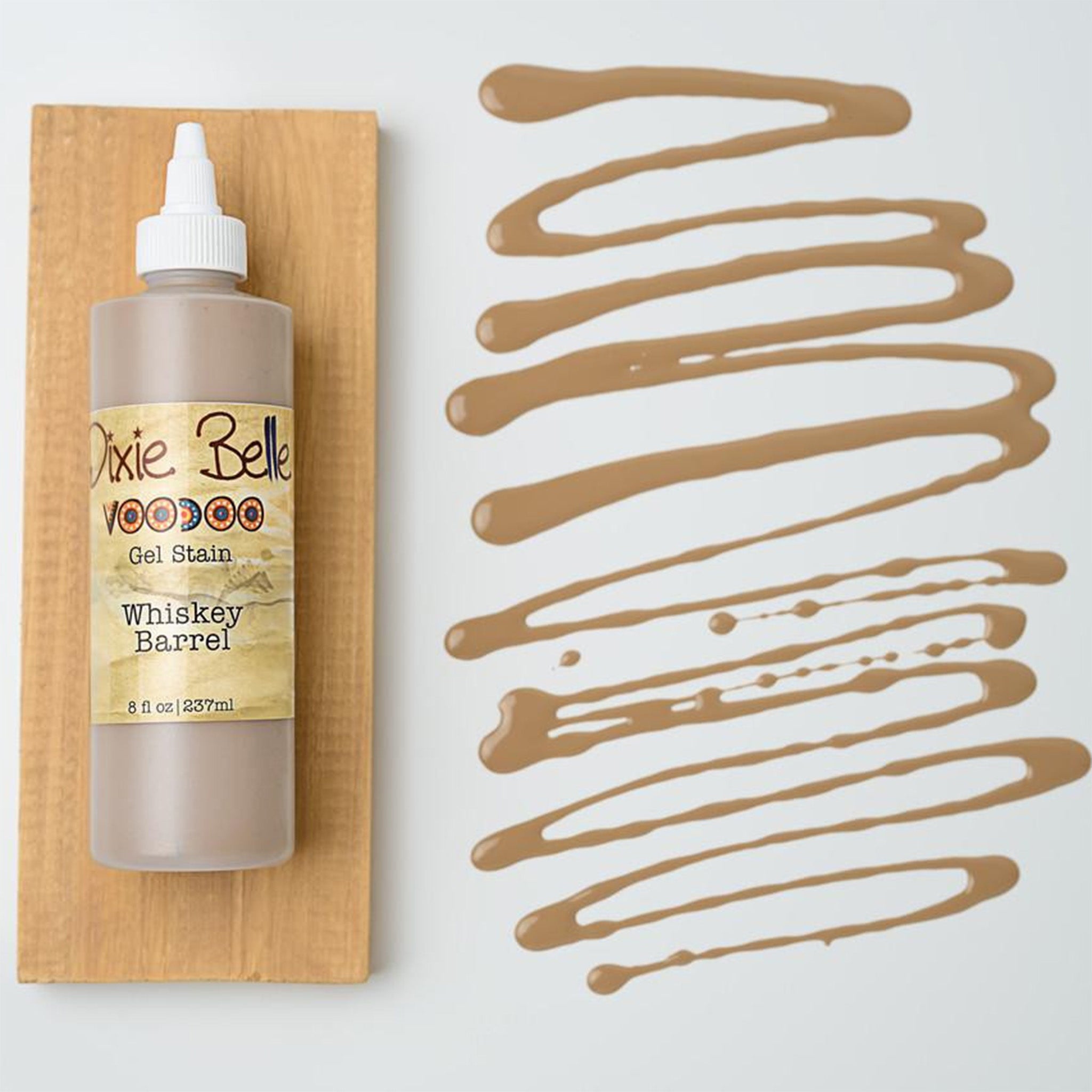 Dixie Belle's Whiskey Barrel Voodoo Gel Stain is against a white background with a wood stained swatch and a poured color sample.