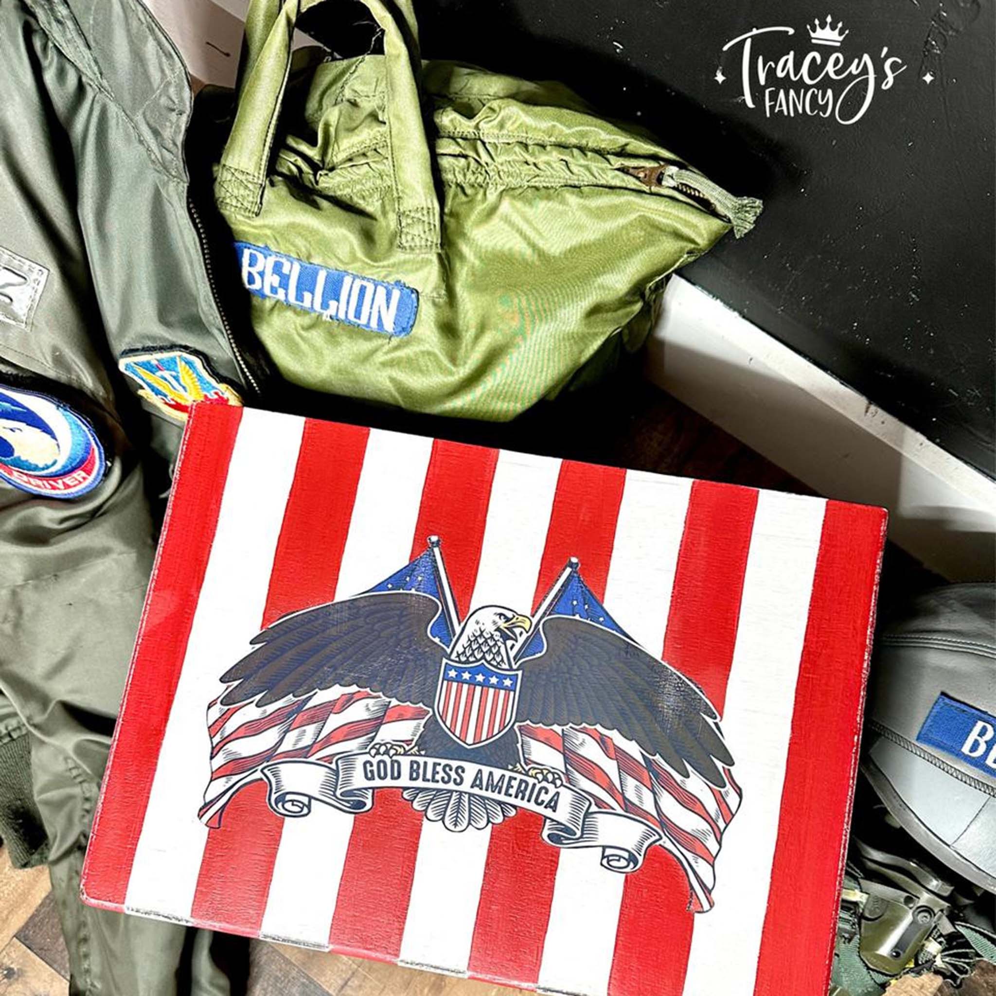 A box refurbished by Tracey's Fancy is sitting on military aircraft clothing and features Belles & Whistles' America the Beautiful furniture transfer.