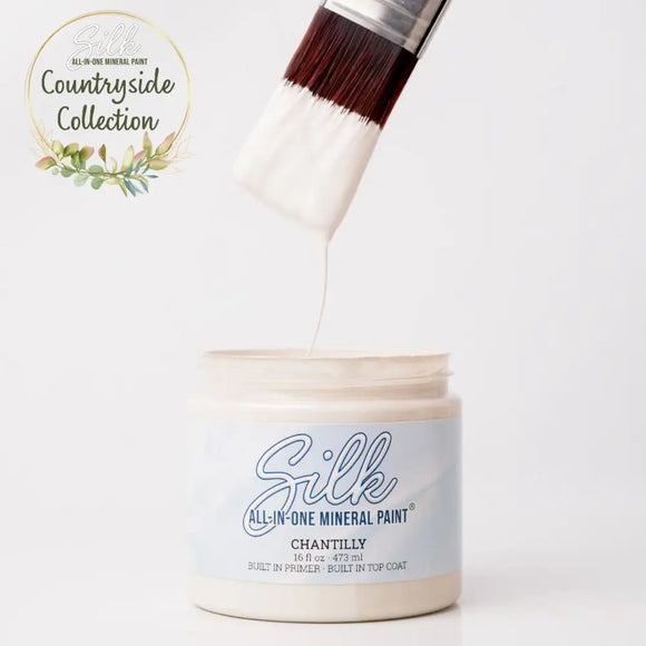 Silk All-in-One Mineral Paint container with a brush applying paint, featuring the 'Countryside Collection' logo.