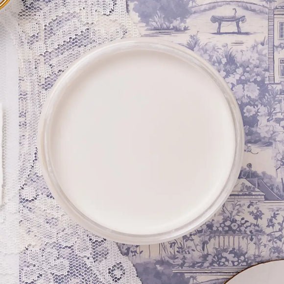 white paint on a blue patterned table.
