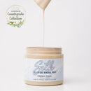 Jar of Silk All-in-One Mineral Paint with a droplet of paint on a white background