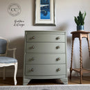 Gray dresser with decorative elements in a room setting