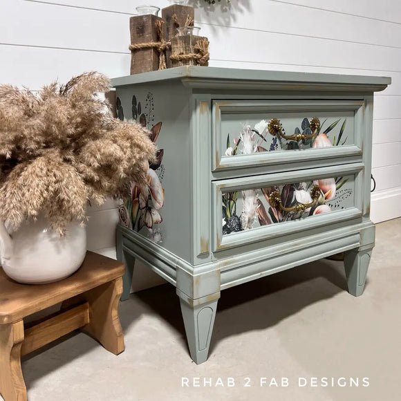 Gray nightstand with decorative elements on a light wooden floor, featuring the brand 'Rehab 2 Fab Designs'.