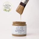 Jar of Silk All-in-One Mineral Paint with a brush dripping paint, labeled 'Countryside Collection'.