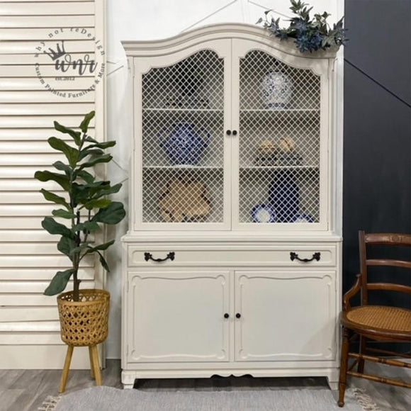 A hutch cabinet with lattice doors refurbished by Why Not ReDesign features Dixie Belle's Endless Shore Silk All-In-One Mineral Paint.
