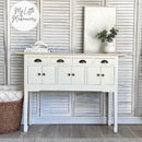 A console table with small drawers and cubby storage refurbished by My Little Makeovers features Dixie Belle's Endless Shore Silk All-In-One Mineral Paint.
