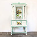 A vintage hutch refurbished by Lyn Wilson Originals features Dixie Belle's Endless Shore Silk All-In-One Mineral Paint along with a pastel teal color.