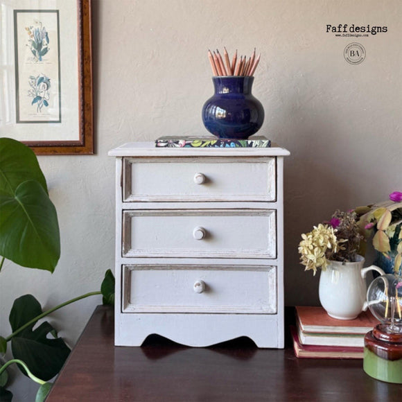 A vintage 3-drawer night stand refurbished by Faff Designs features Dixie Belle's Glacier Silk All-In-One Mineral Paint.