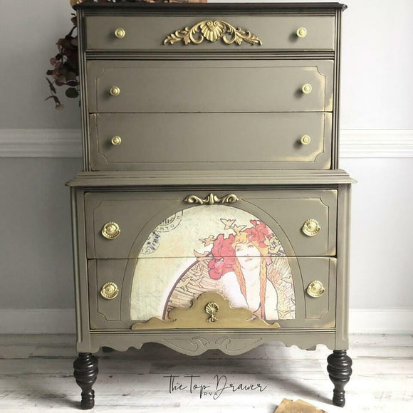 A vintage large 5-drawer lingerie dresser refurbished by The Top Drawer features Dixie Belle's Hampton Olive Silk All-In-One Mineral Paint.