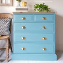 A 5-drawer chest dresser refurbished by Annie Loveday Furniture features Dixie Belle's Harbor Silk All-In-One Mineral Paint.