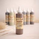Dixie Belle Voodoo Gel Stain Charred Hickory bottle centered with other stain colors softly blurred in the background, styled in warm neutral light.