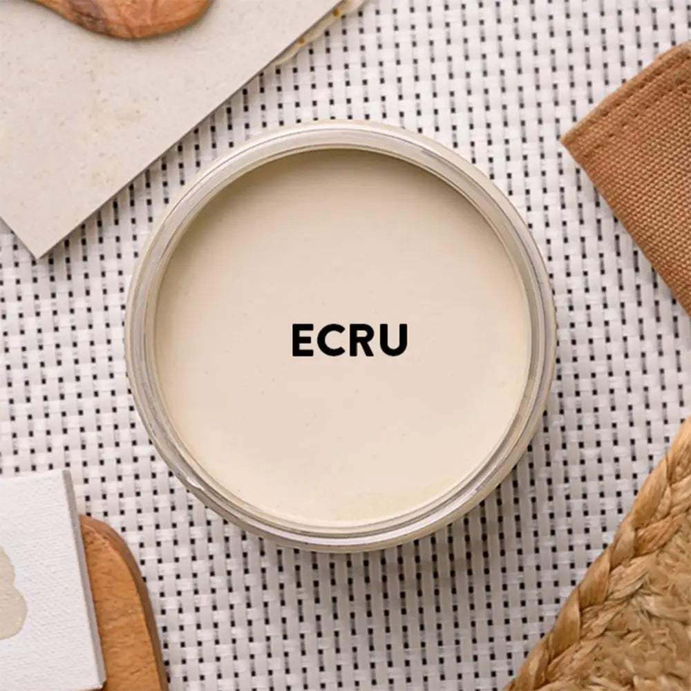 An arial view of an open container of Dixie Belle Paint Company's Ecru Chalk Mineral Paint is shown with black text reading Ecru.