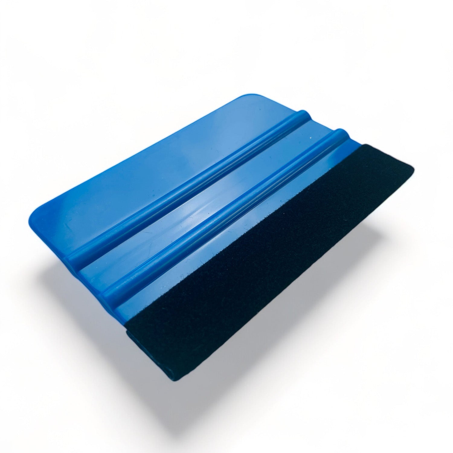 A 4 inch rectangular blue handled felt edge crafting squeegee is against a white background.