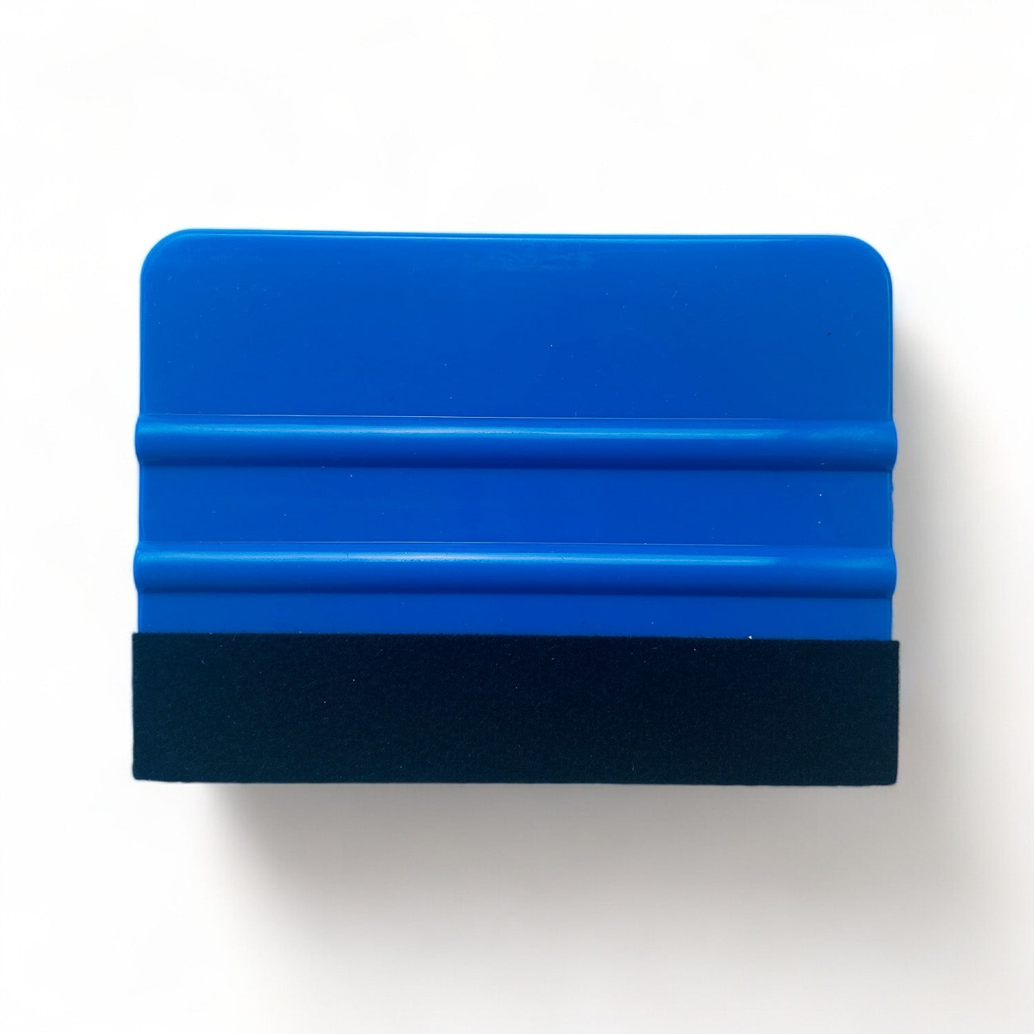 A 4 inch rectangular blue handled felt edge crafting squeegee is against a white background.