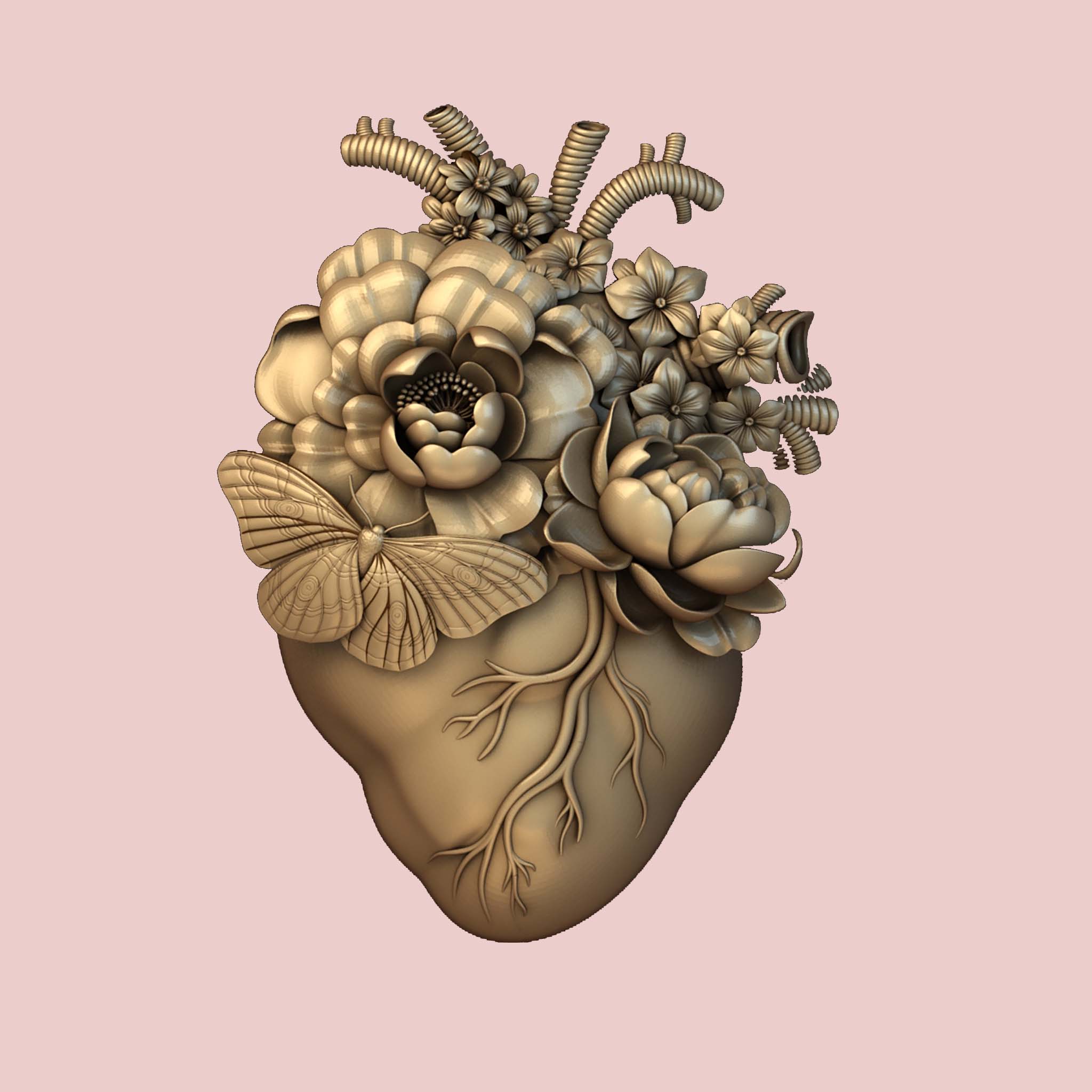 A gold colored silicone mold casting of an anatomical heart with flowers coming out of it is against a light pink background.