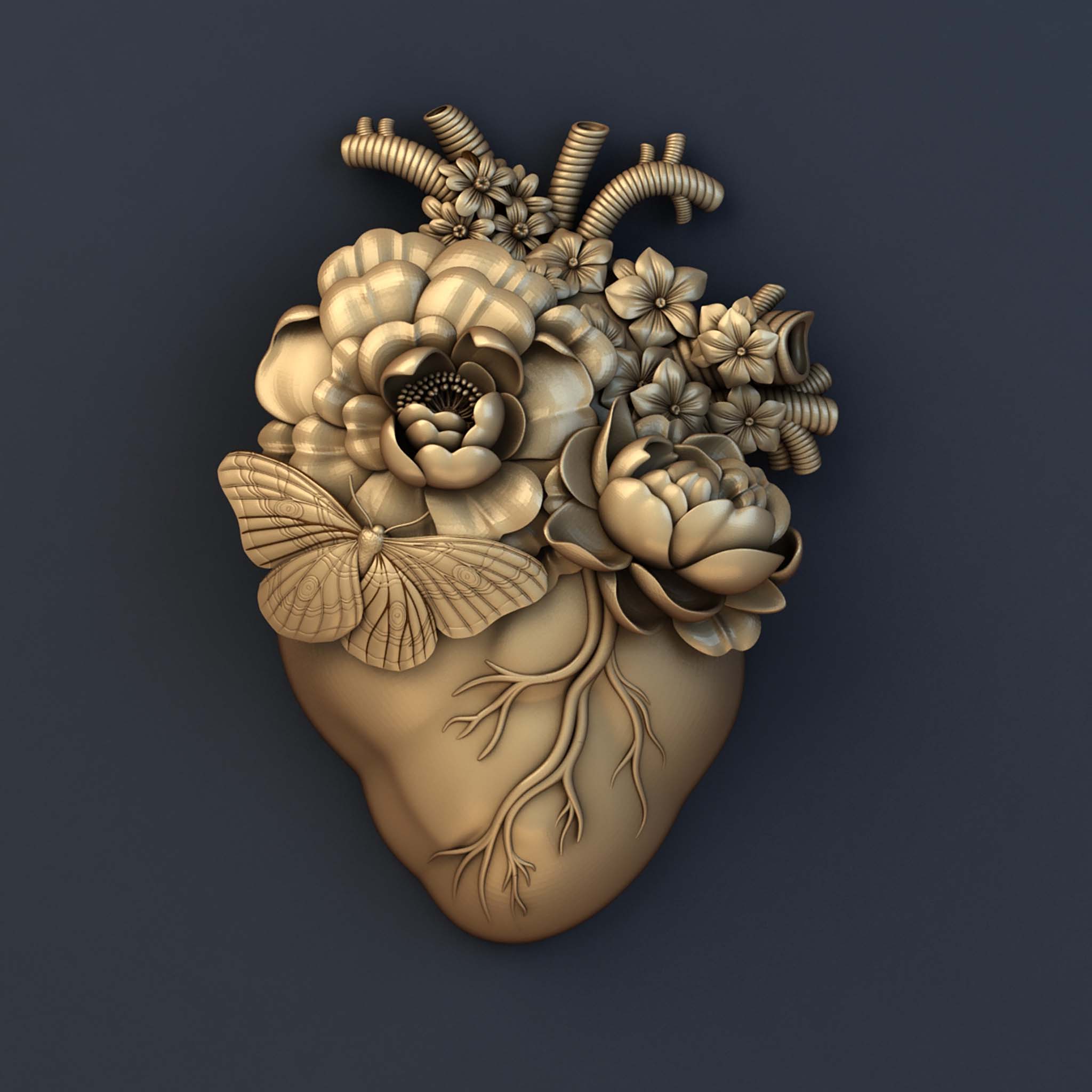 A gold colored silicone mold casting of an anatomical heart with flowers coming out of it is against a dark grey background.