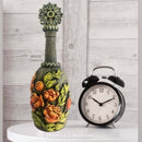 Upcycled decorative bottle with raised rose bouquet appliquŽs made using the Blooming Opulence silicone mold