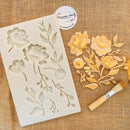 Dadarkar Art Blooming Opulence silicone mold with rose bouquet, buds and leaves beside a finished gilded floral casting