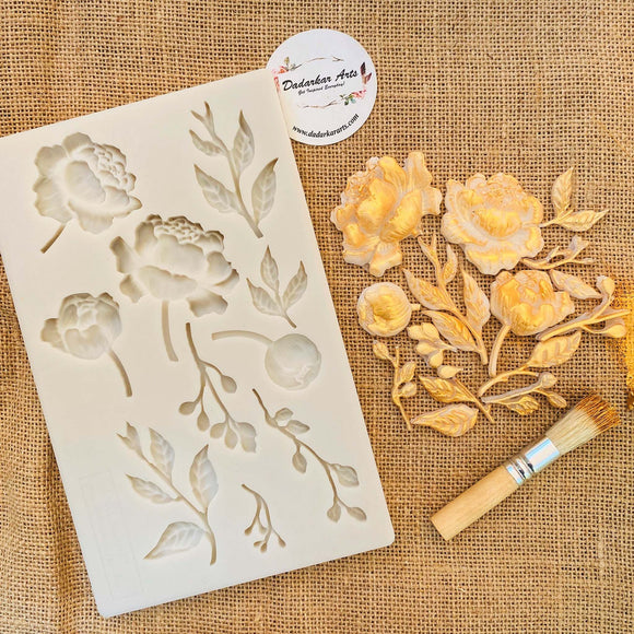 Dadarkar Art Blooming Opulence silicone mold with rose bouquet, buds and leaves beside a finished gilded floral casting