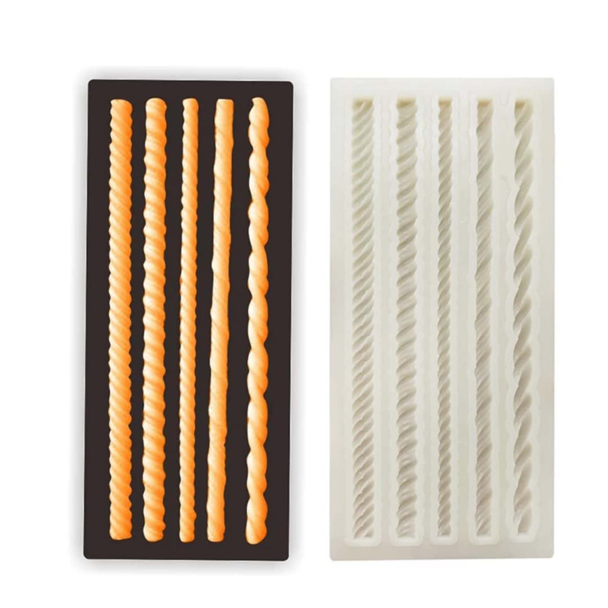 A light beige silicone mold and orange colored castings shown against black of 5 mini rope borders are on a white grey background.