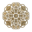 A gold colored mandala with lotus flowers in the design is against a white background.