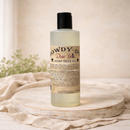 Dixie Belle Paint Howdy-Do Hemp Oil bottle on wood surface, 8 oz hemp seed oil finish for raw wood and painted furniture