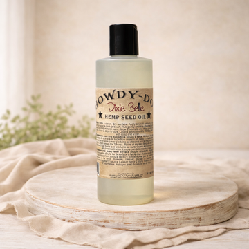 Dixie Belle Paint Howdy-Do Hemp Oil bottle on wood surface, 8 oz hemp seed oil finish for raw wood and painted furniture