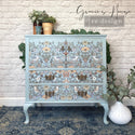 A vintage dresser armoire refurbished by Gracie's House is painted light blue and features ReDesign with Prima's Albery transfer on its doors and drawers.