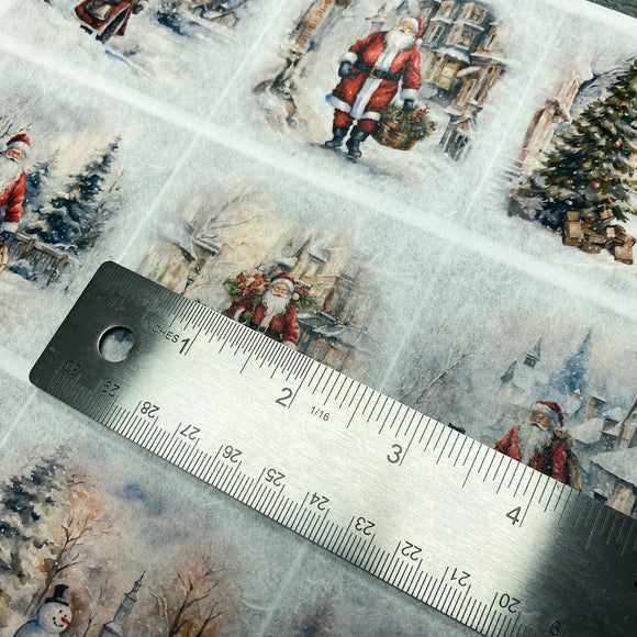 Christmas-themed decoupage paper with Santa Claus illustrations and a ruler for scale.