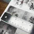 Ruler on a sheet of paper with winter-themed illustrations