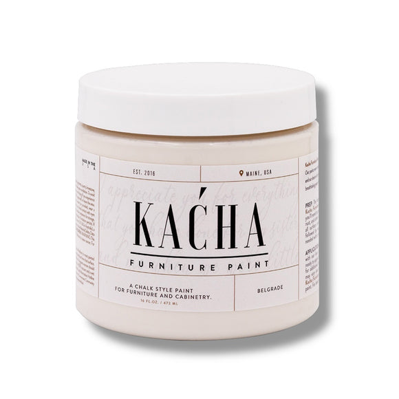 A 16 oz container of Kacha Furniture Paint in the color Belgrade (off-white) is against a white background.