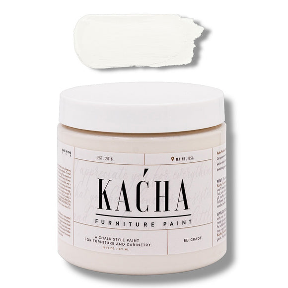 A 16 oz container and swatch sample of Kacha Furniture Paint in the color Belgrade (off-white) is against a white background.