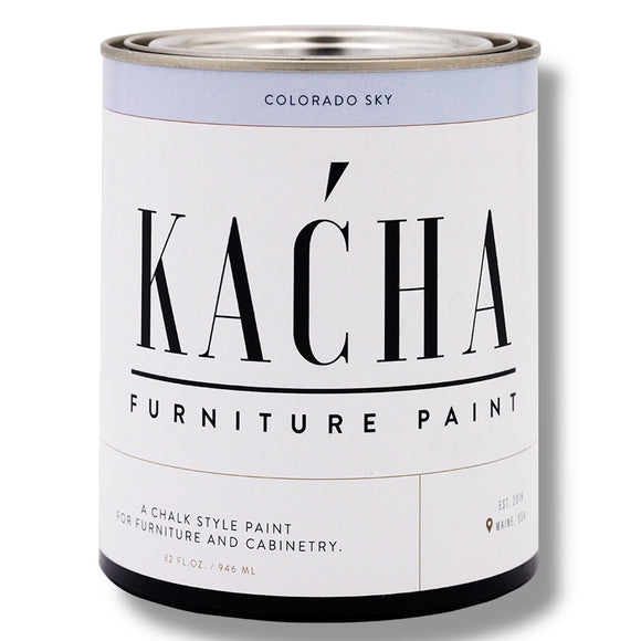 A 32oz can of Kacha Furniture Paint in the color Colorado Sky (soft pale blue) is against a white background.