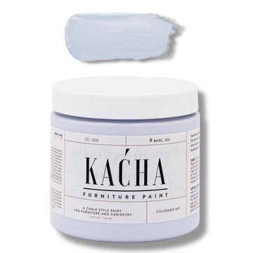 A 16 oz container and swatch sample of Kacha Furniture Paint in the color Colorado Sky (soft pale blue) is against a white background.