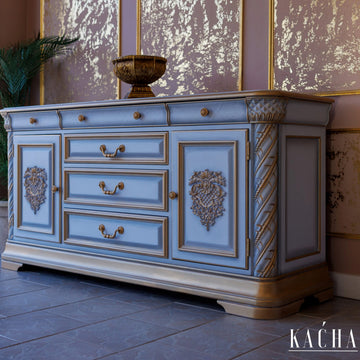 A large vintage buffet table features KACHA Colorado Sky furniture paint with dark gold accents.