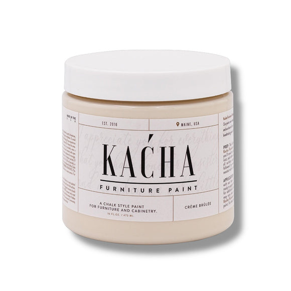 A 16 oz container and swatch sample of Kacha Furniture Paint in the color Creme Brulee (neutral beige) is against a white background.