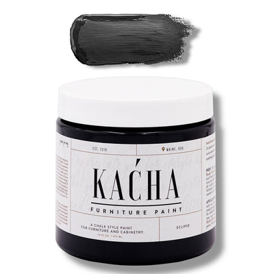 A 16 oz container and swatch sample of Kacha Furniture Paint in the color Eclipse (true black) is against a white background.