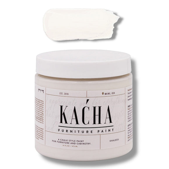 A 16 oz container and swatch sample of Kacha Furniture Paint in the color Kahleesi (bright white) is against a white background.