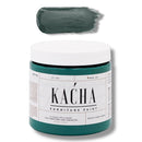 A 16 oz container and swatch sample of Kacha Furniture Paint in the color Maine Forest Green is against a white background.
