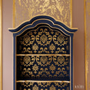 A close-up of a hutch refurbished by Kacha features Kacha Royal Blue paint with gold details.