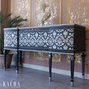 A vintage console table refurbished by Kacha features Kacha Furniture Paint in the color Siva Grey with a damask design in white on it.