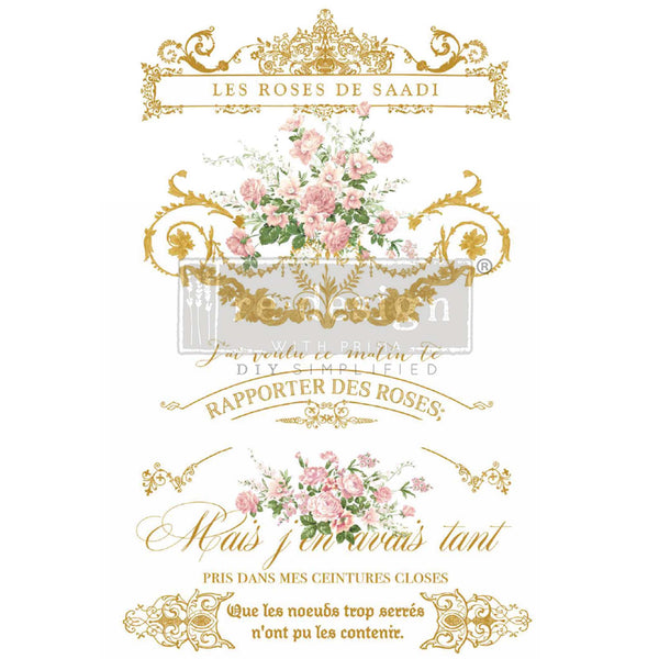 Rub-on transfer that features French script and intricate scroll work in gold with bouquets of colorful pink roses.