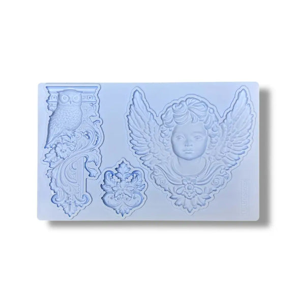 Silicone mold with decorative designs on a light blue background