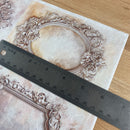 Decorative frame with intricate designs on a textured surface, accompanied by a ruler for scale.