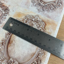 Ruler on decorative paper with intricate patterns