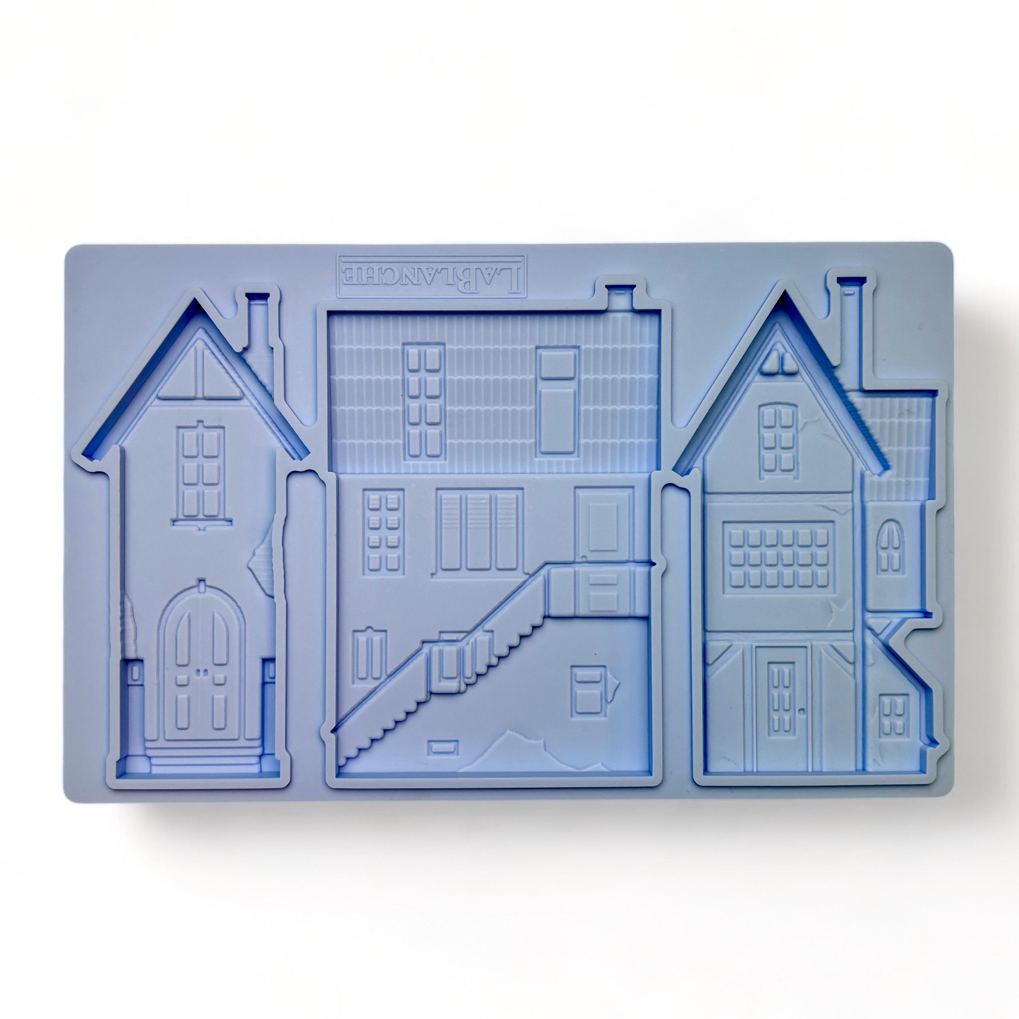 A blue silicone mold of 3 unique 3-story homes is against a white background.