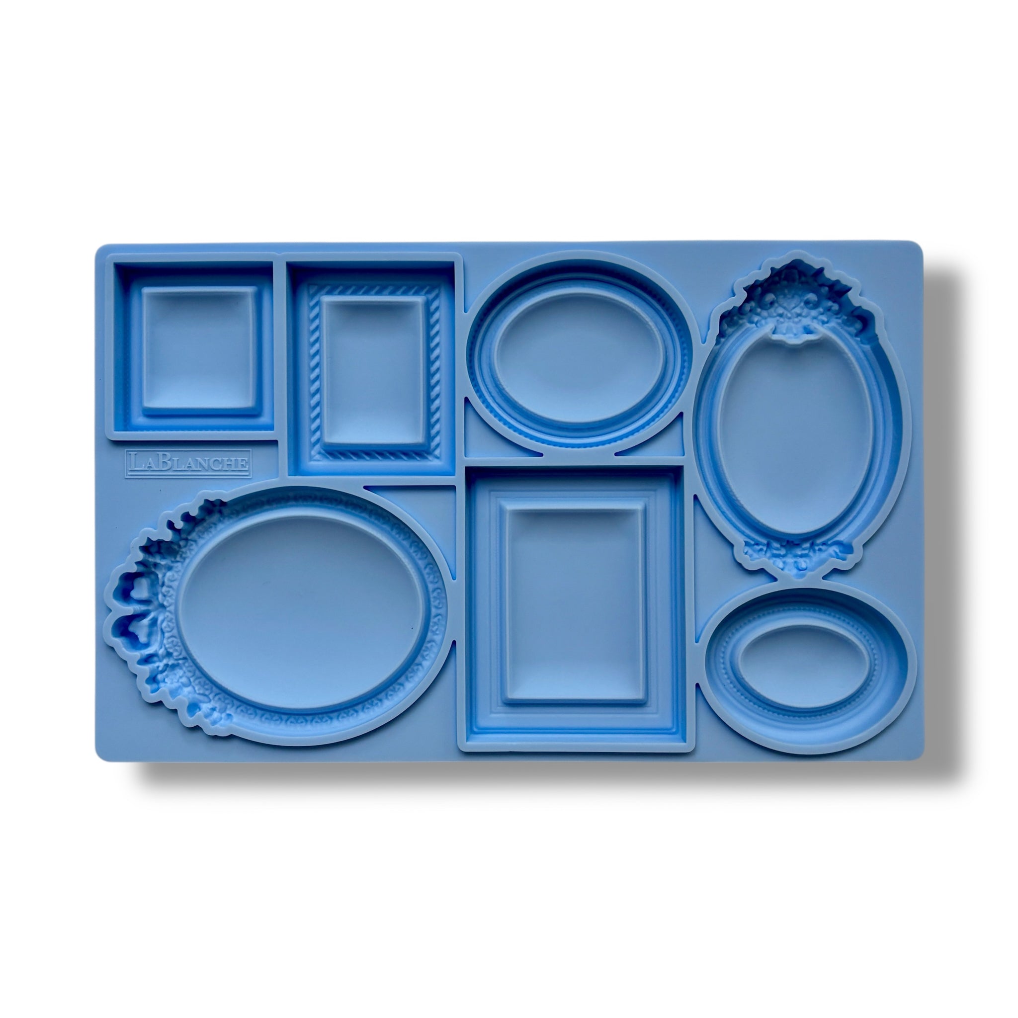 A blue silicone mold featuring 7 small square, oval, and rectangular vintage photo frames is against a white background.