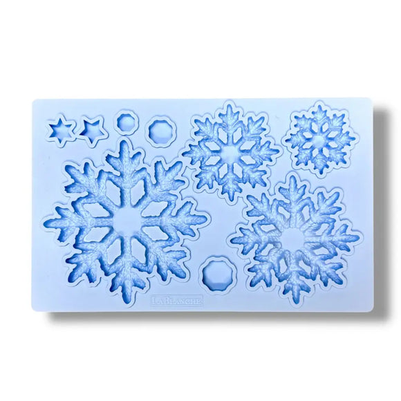 Silicone mold with snowflake designs on a white background